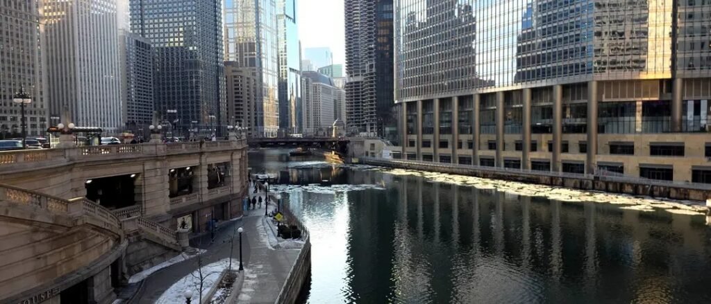 Chicago Riverwalk beside downtown towers and the Chicago River