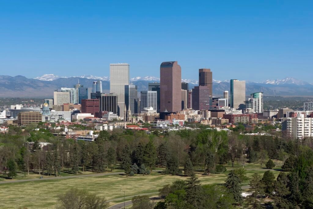 Denver skyline with the Rocky Mountains behind the city