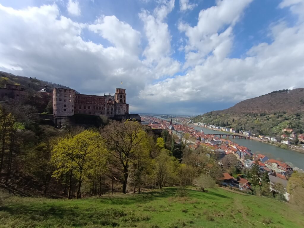 Heidelberg Castle above the red-roofed Old Town and Neckar valley