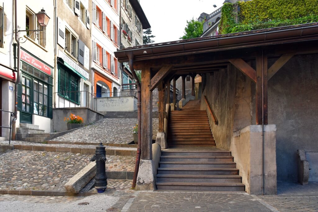Covered wooden Market Stairs climbing through Lausanne's historic center