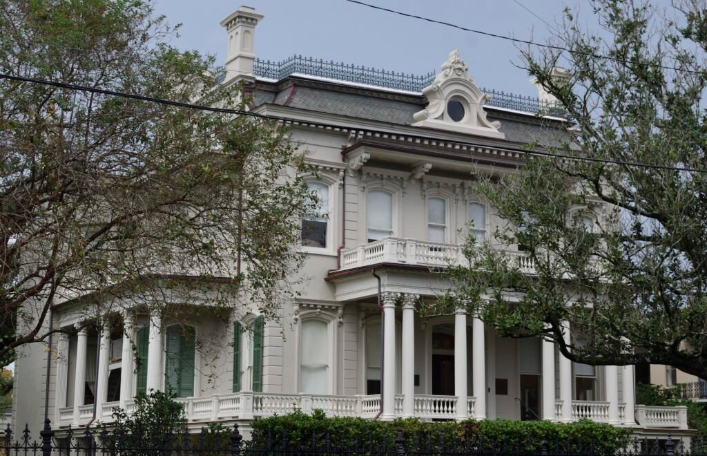Historic mansion framed by trees in the Garden District of New Orleans