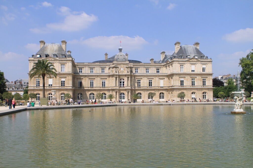 Luxembourg Palace beyond the fountain pool in the Jardin du Luxembourg in Paris