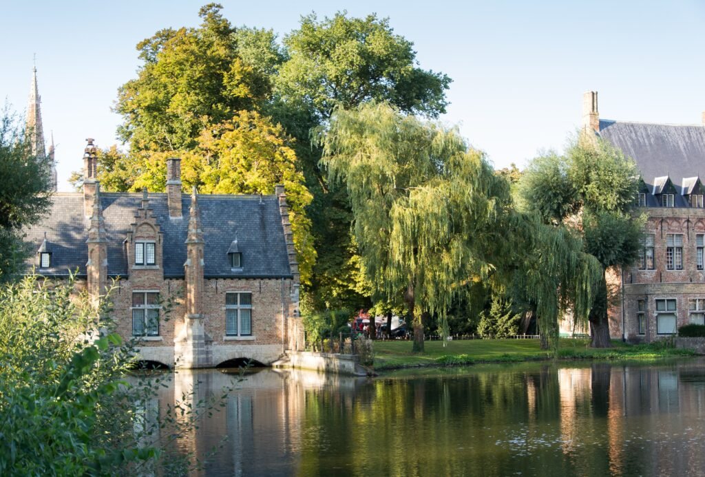Minnewater and historic Sashuis in Bruges