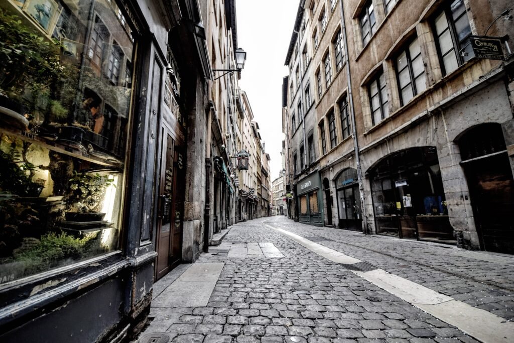 Narrow historic street lined with old buildings in Vieux Lyon