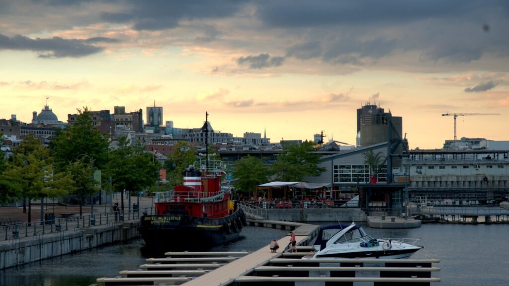Old Port of Montréal waterfront with boats and the historic city behind