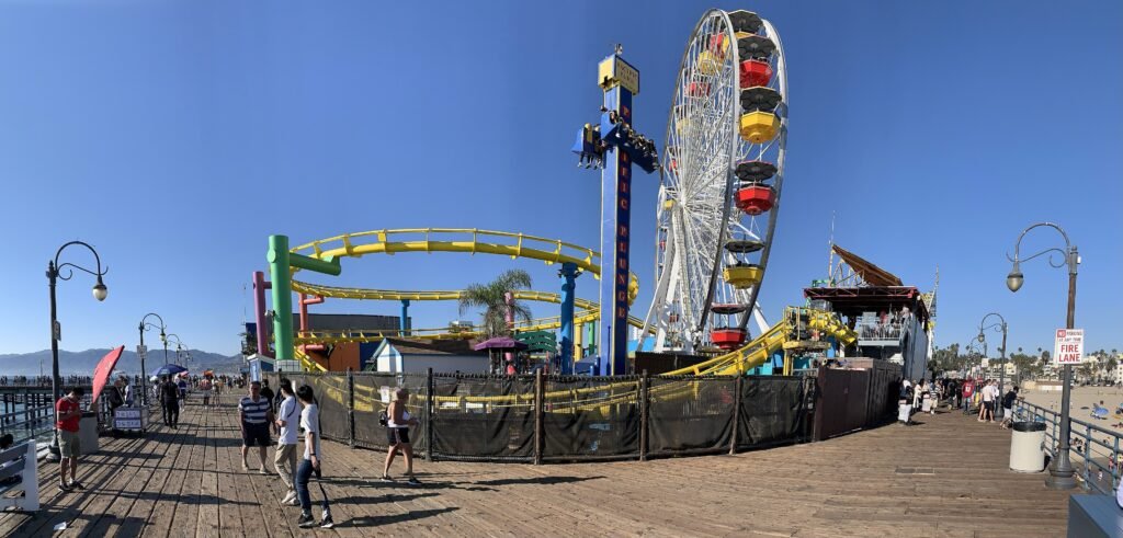 Pacific Park rides on Santa Monica Pier beside the Pacific Ocean