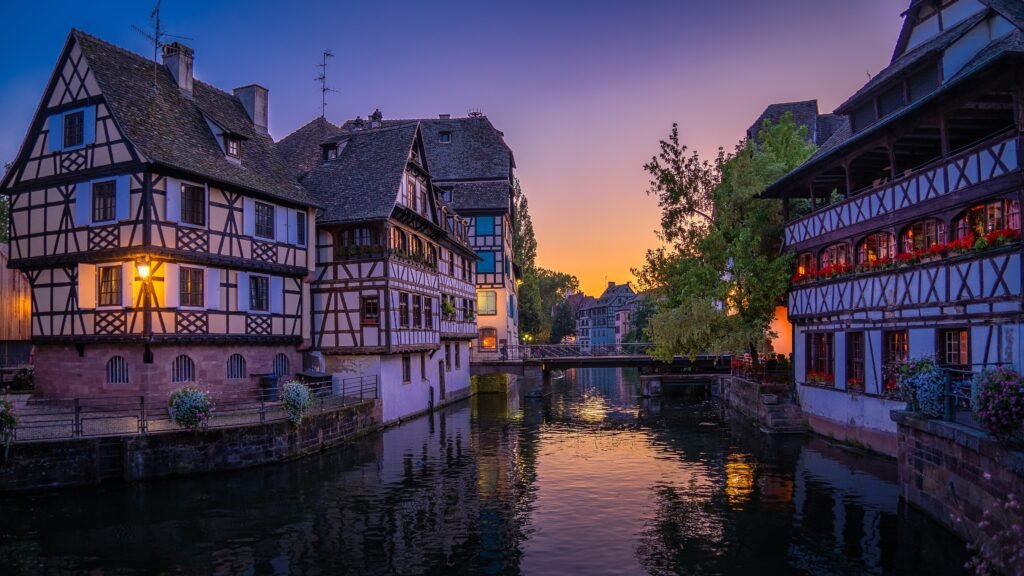 Half-timbered houses and canals in Petite France, Strasbourg, at dusk