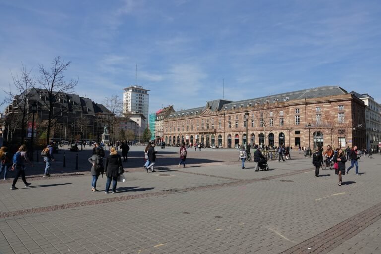 Pedestrians crossing Place Kléber in central Strasbourg