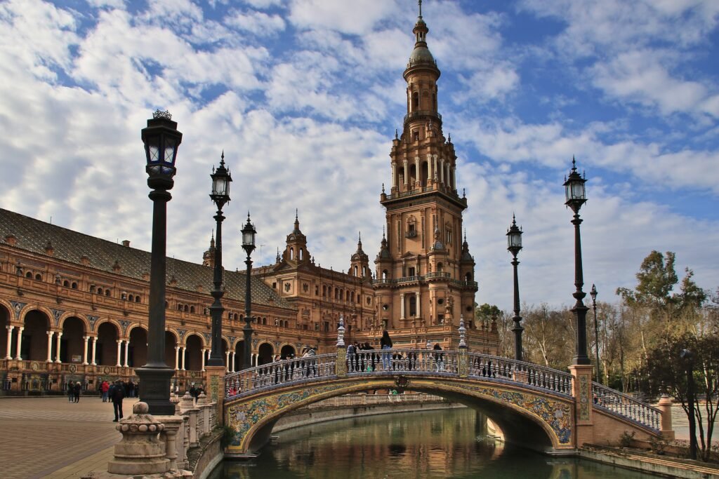 Plaza de España in Seville with its curved facade, canal and bridges
