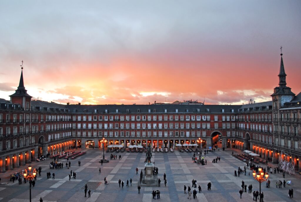Plaza Mayor in Madrid at sunset with arcades surrounding the square