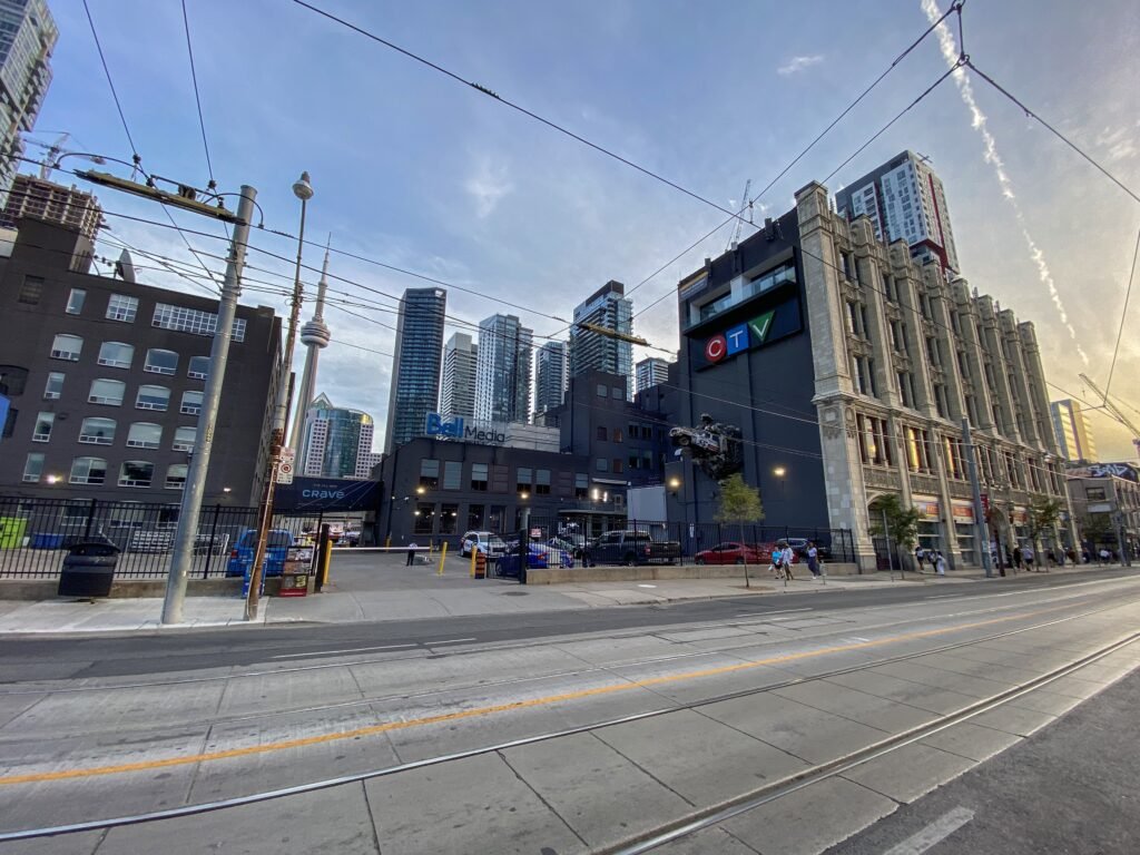Queen Street West in Toronto with sidewalks and streetcar tracks