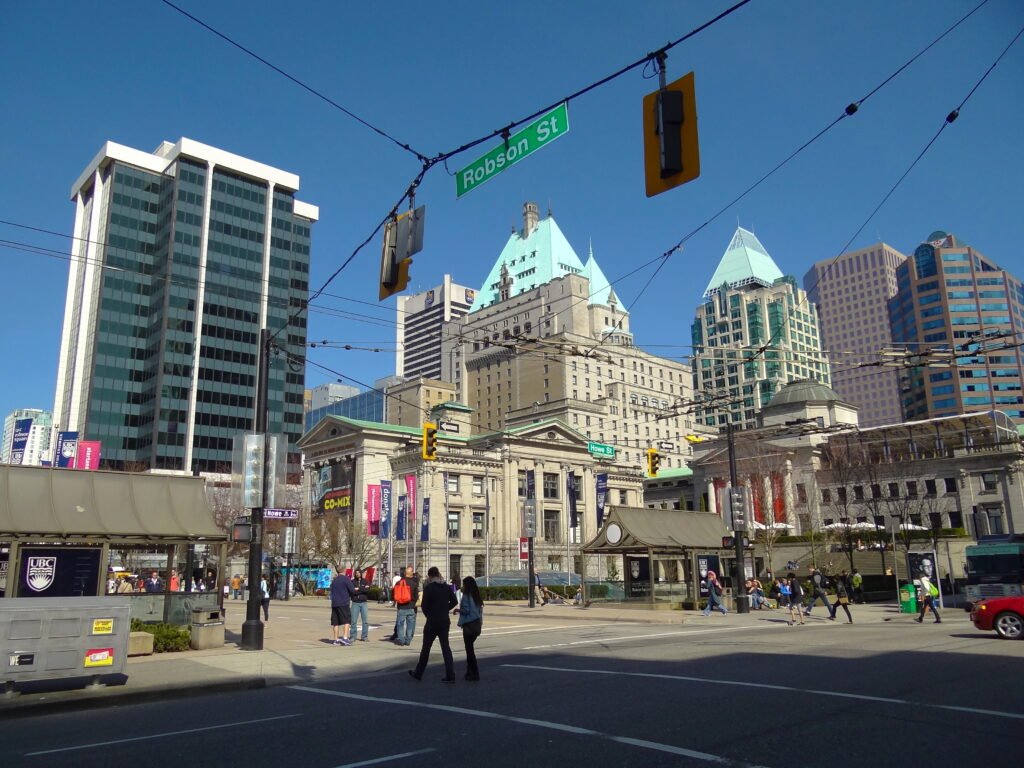 Pedestrians crossing Robson Street in downtown Vancouver