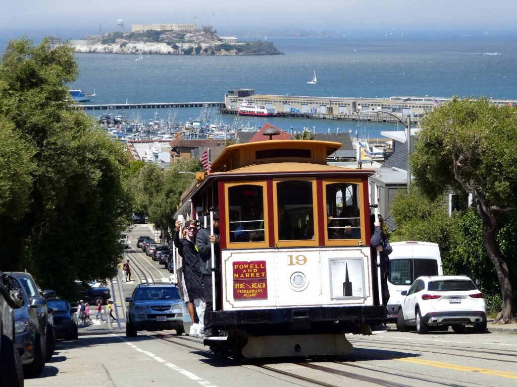 San Francisco cable car climbing Hyde Street with the bay in the distance