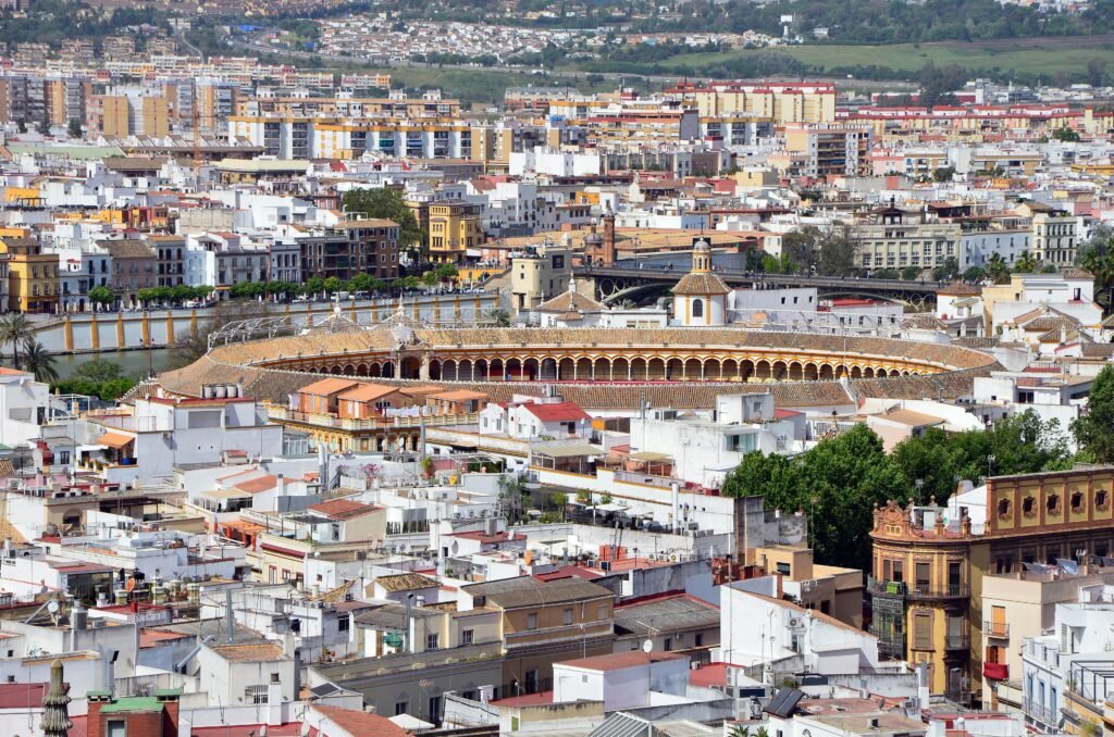 Seville historic center with the Maestranza, Calle Betis and Triana Bridge viewed from the Giralda