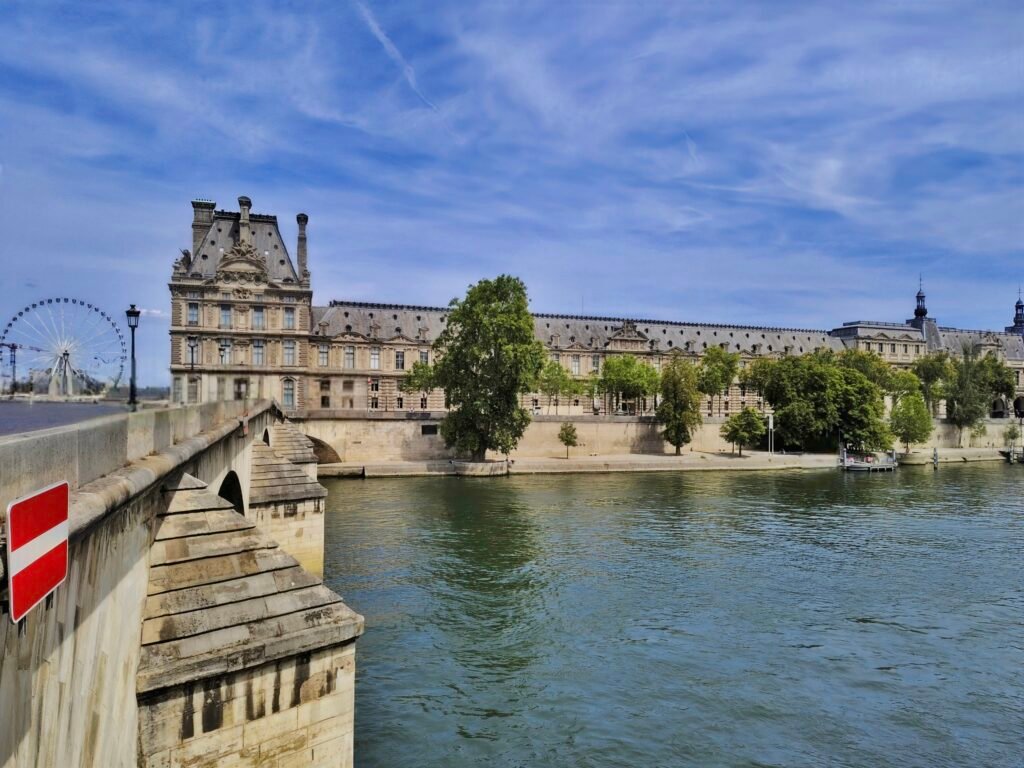 Seine River in central Paris with the Louvre visible beyond the river