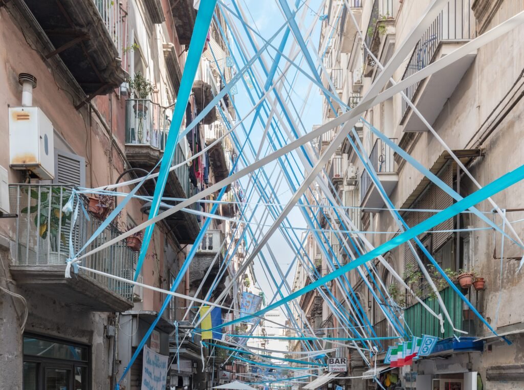 Pedestrians on Via dei Tribunali in the historic center of Naples