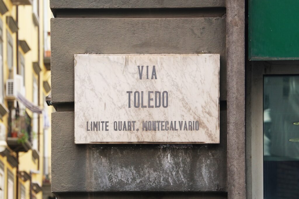 Pedestrians walking along Via Toledo in central Naples
