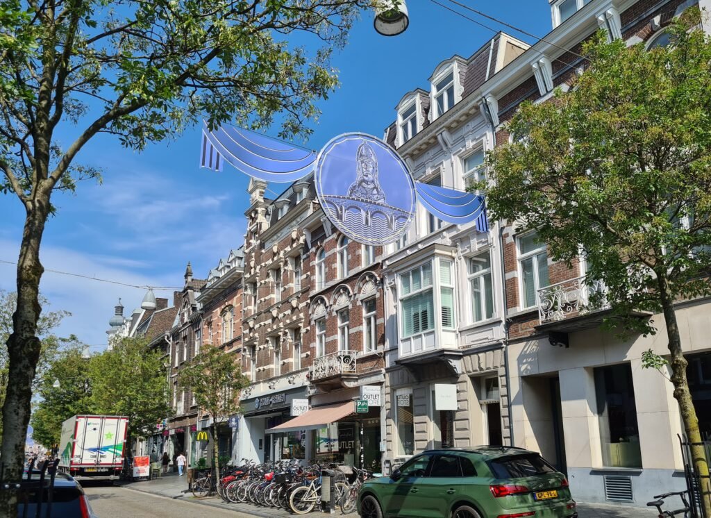 Wycker Brugstraat in Maastricht with shops and pedestrians