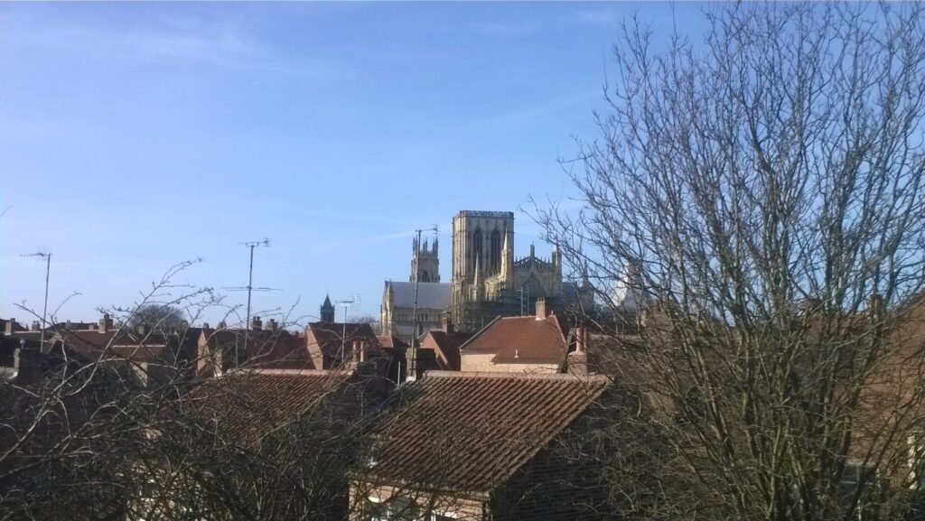 York Minster viewed across historic rooftops from the city walls