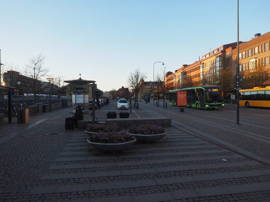 Bangatan beside Lund Central Station with pedestrian space, bicycles and local transport