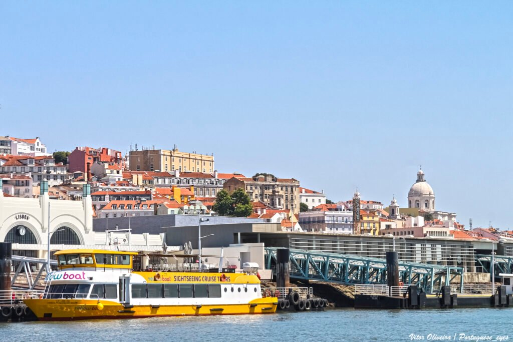 Cais do Sodré waterfront station area with Lisbon's hillside buildings behind