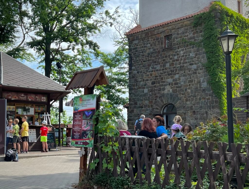 Diana Observation Tower summit area with visitors in Karlovy Vary