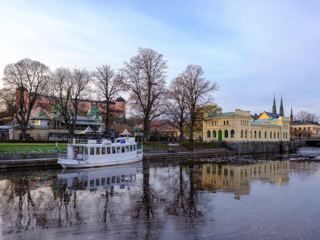 Fyris River in Uppsala with the castle and cathedral towers in the background