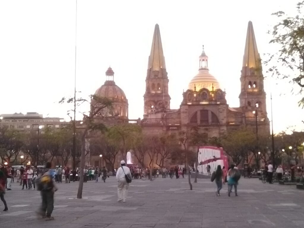 Guadalajara Cathedral across Plaza de la Liberación with pedestrians in the square