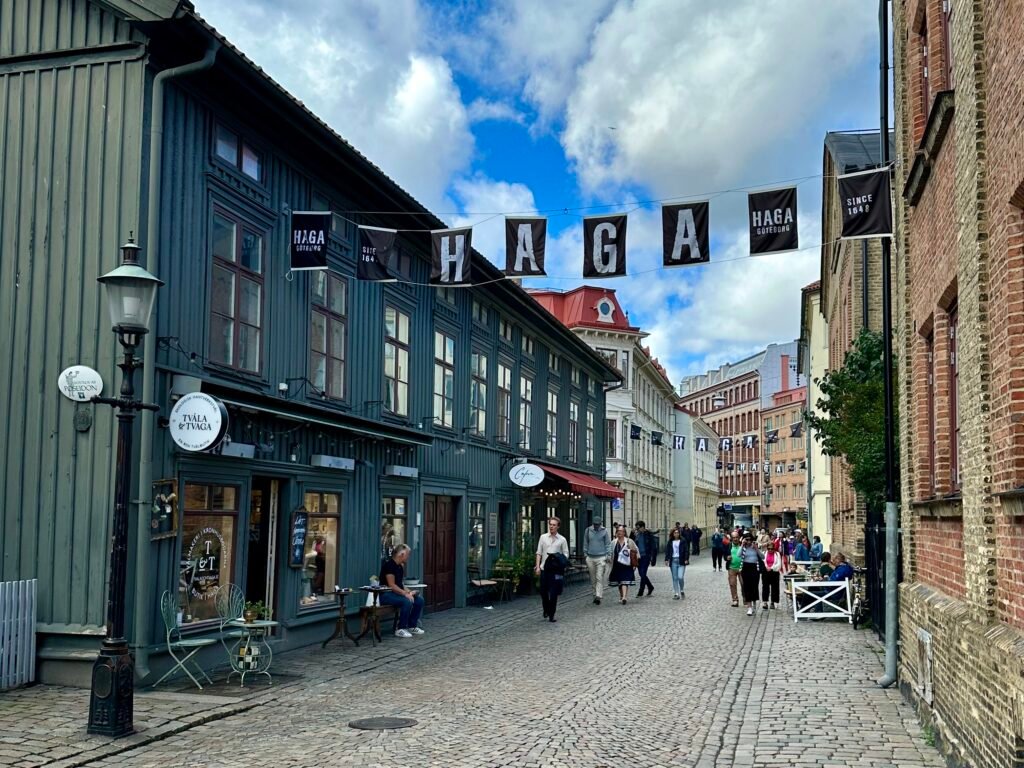Cobbled Haga Nygata with pedestrians and historic buildings in Gothenburg