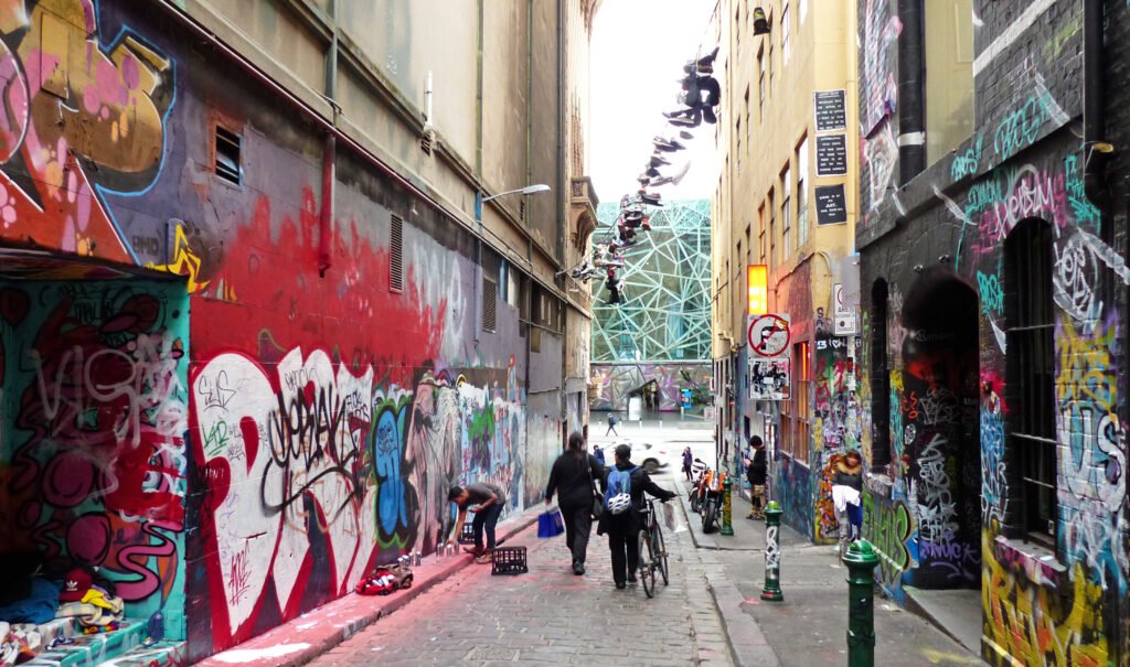 Pedestrians walking through Hosier Lane in central Melbourne