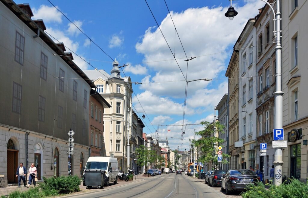 Krakowska Street in Kazimierz with sidewalks, tram tracks and street traffic