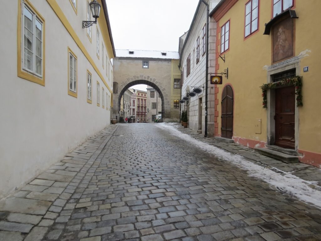 Historic Latrán street in Český Krumlov with stone paving and narrow building frontage