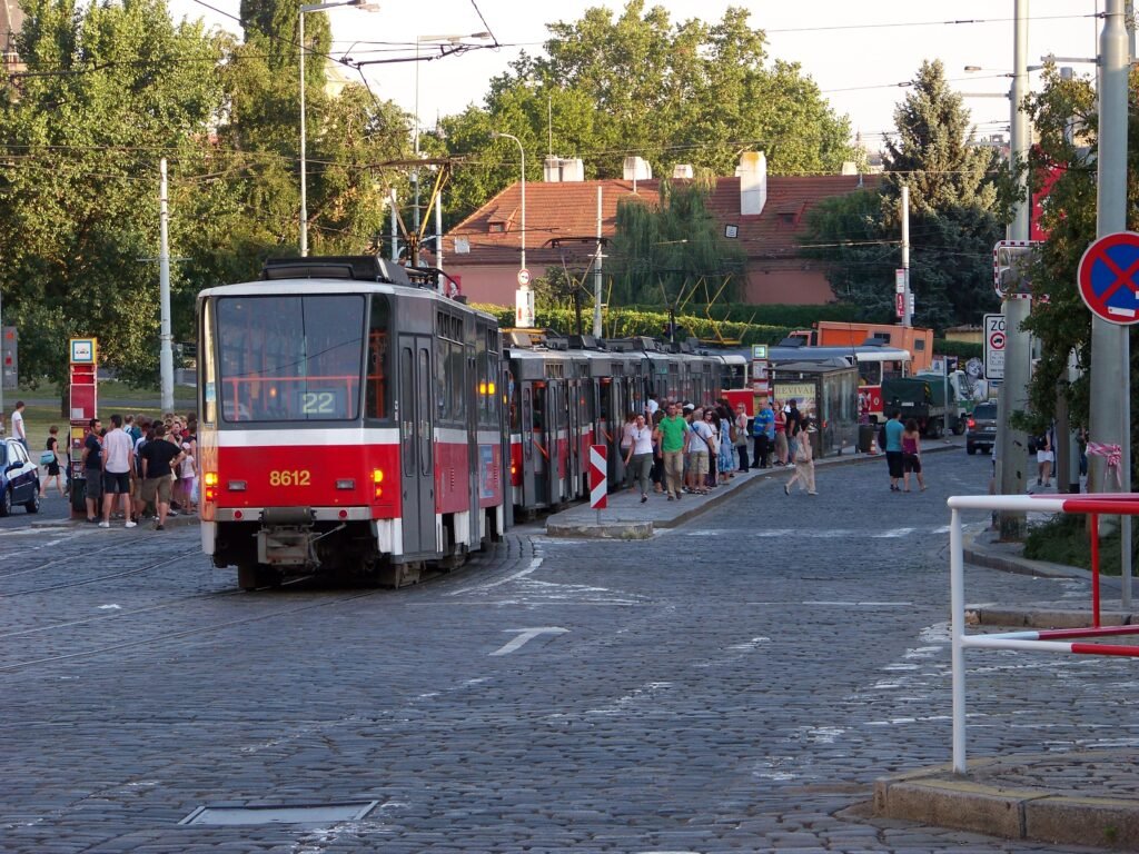 Trams and pedestrians at Malostranská in Prague