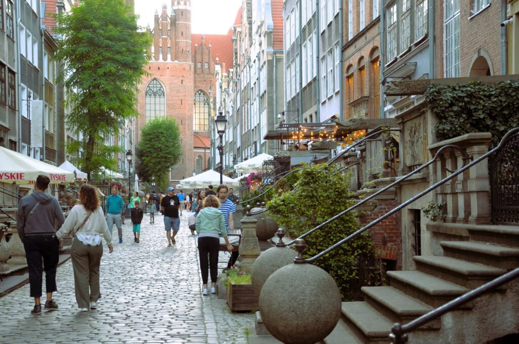 Visitors walking on the cobbled Mariacka Street in Gdańsk