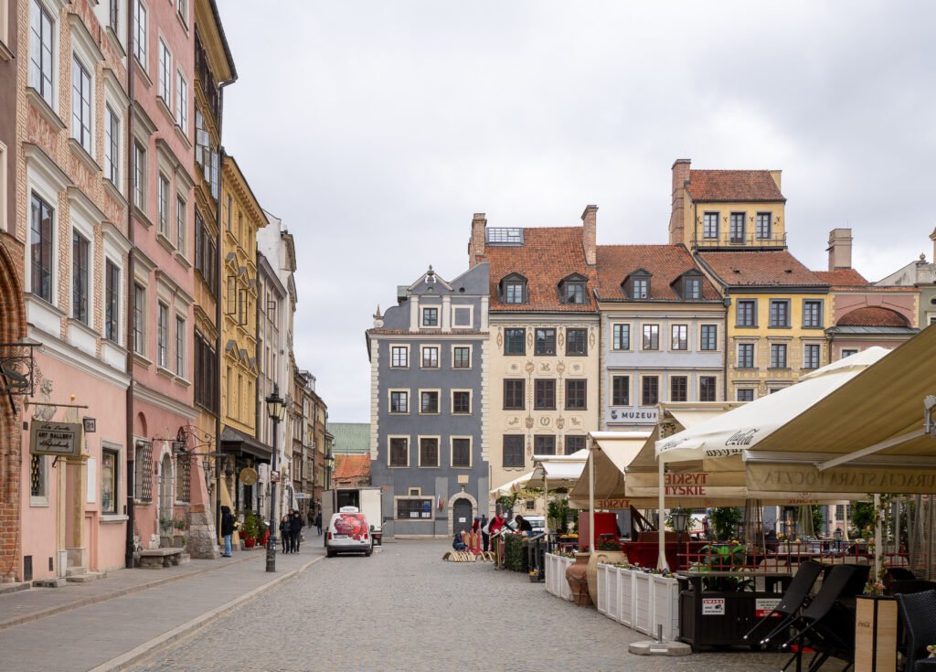 Historic paving and café terraces at Warsaw Old Town Market Square