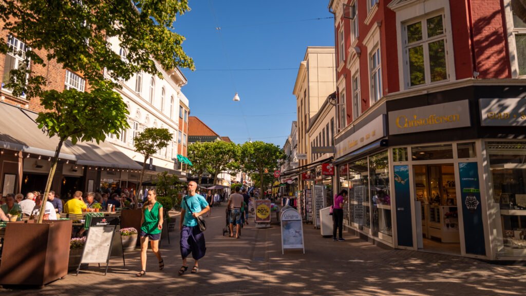 People walking along a pedestrian street in central Odense