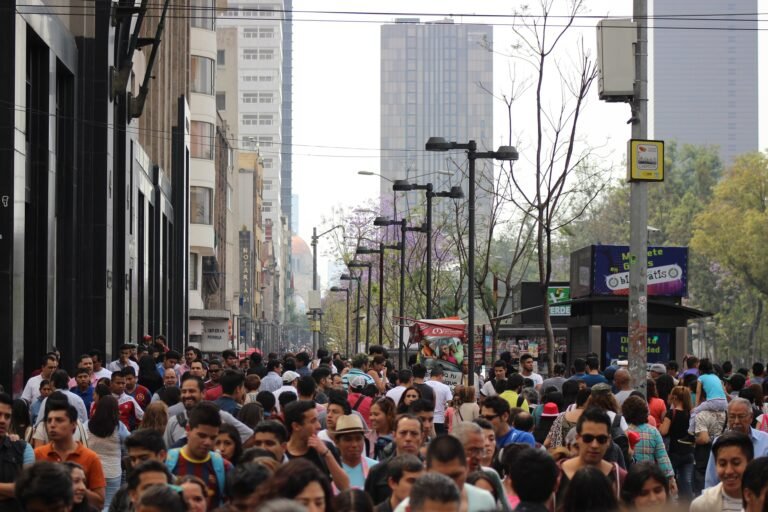 Pedestrians walking along Francisco I. Madero in Mexico City's Centro Histórico