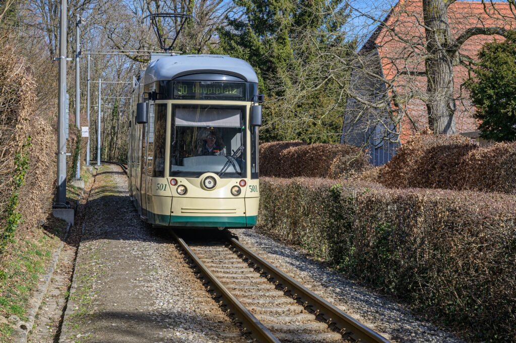 Modern Pöstlingbergbahn tram climbing the hillside route above Linz