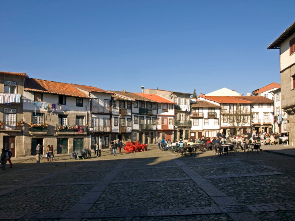 Praça de Santiago in Guimarães with historic houses, cafés and stone paving