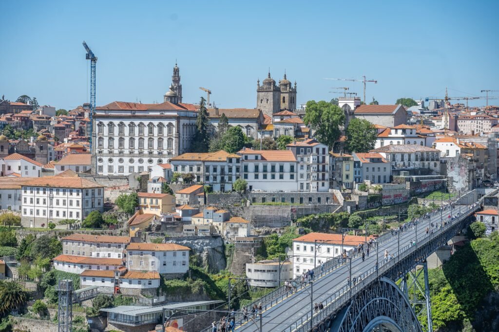 Porto’s Ribeira hillside above Dom Luís I Bridge with pedestrians crossing the upper deck