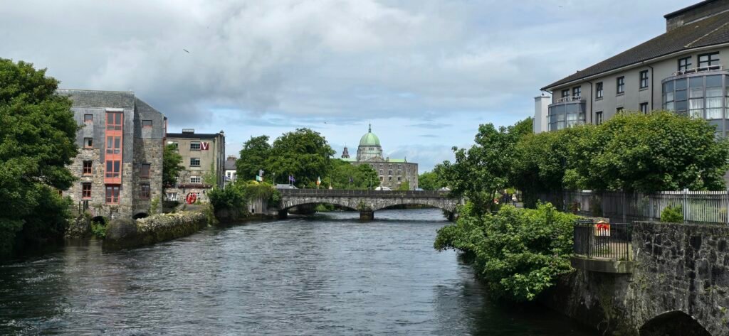 River Corrib in Galway with the cathedral dome beyond the bridge