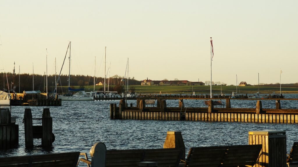 Roskilde Harbor with piers, boats and Roskilde Fjord
