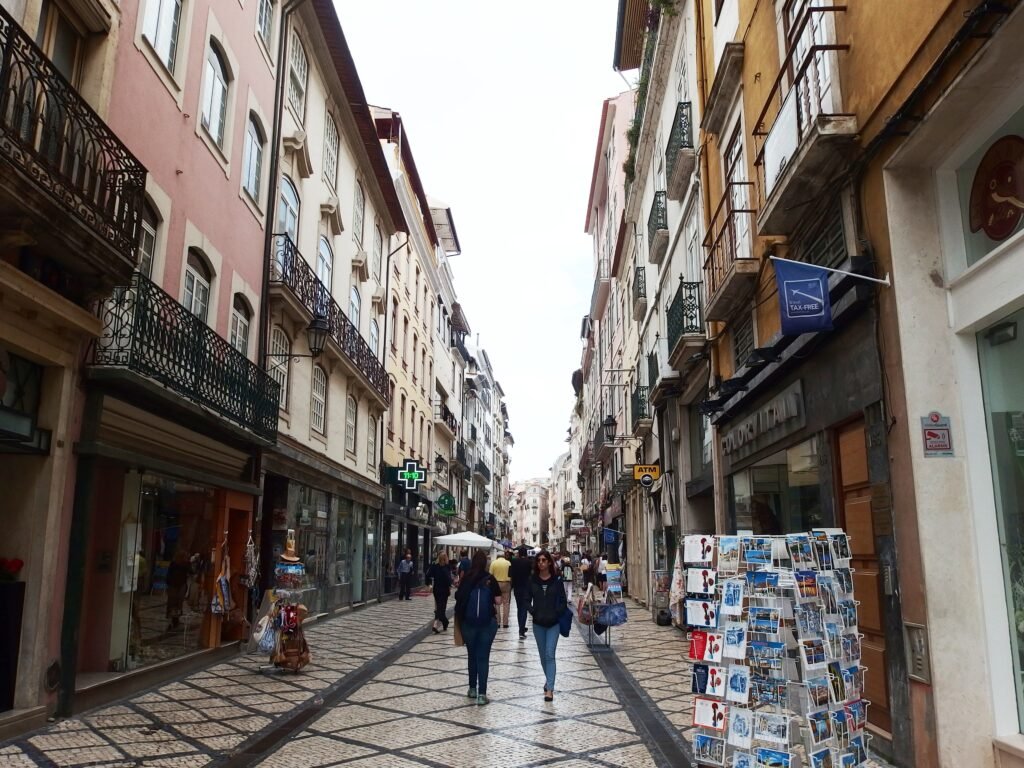 Pedestrians on Rua Ferreira Borges in central Coimbra