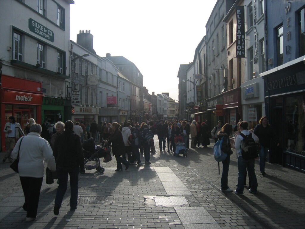 Crowded pedestrianized Shop Street in Galway city center