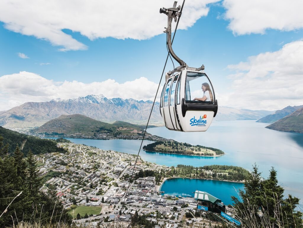 Skyline Queenstown Gondola ascending above Queenstown toward Bob’s Peak
