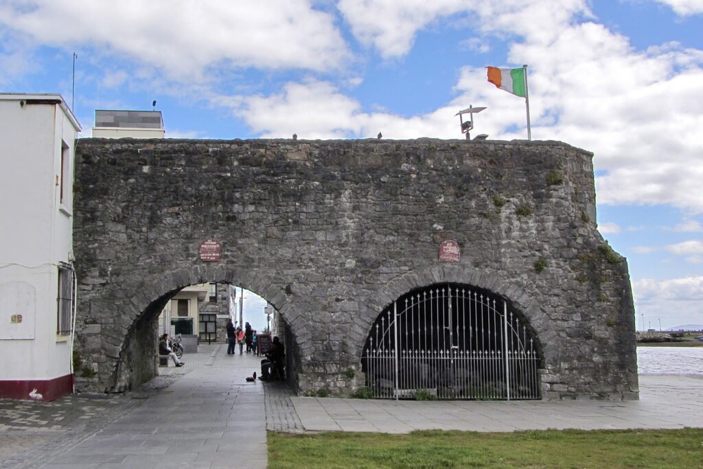 Stone arches of the Spanish Arch beside the Corrib in Galway