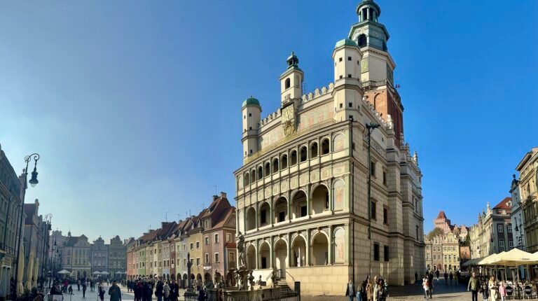 Pedestrians and historic buildings around Stary Rynek in Poznań after the square reconstruction