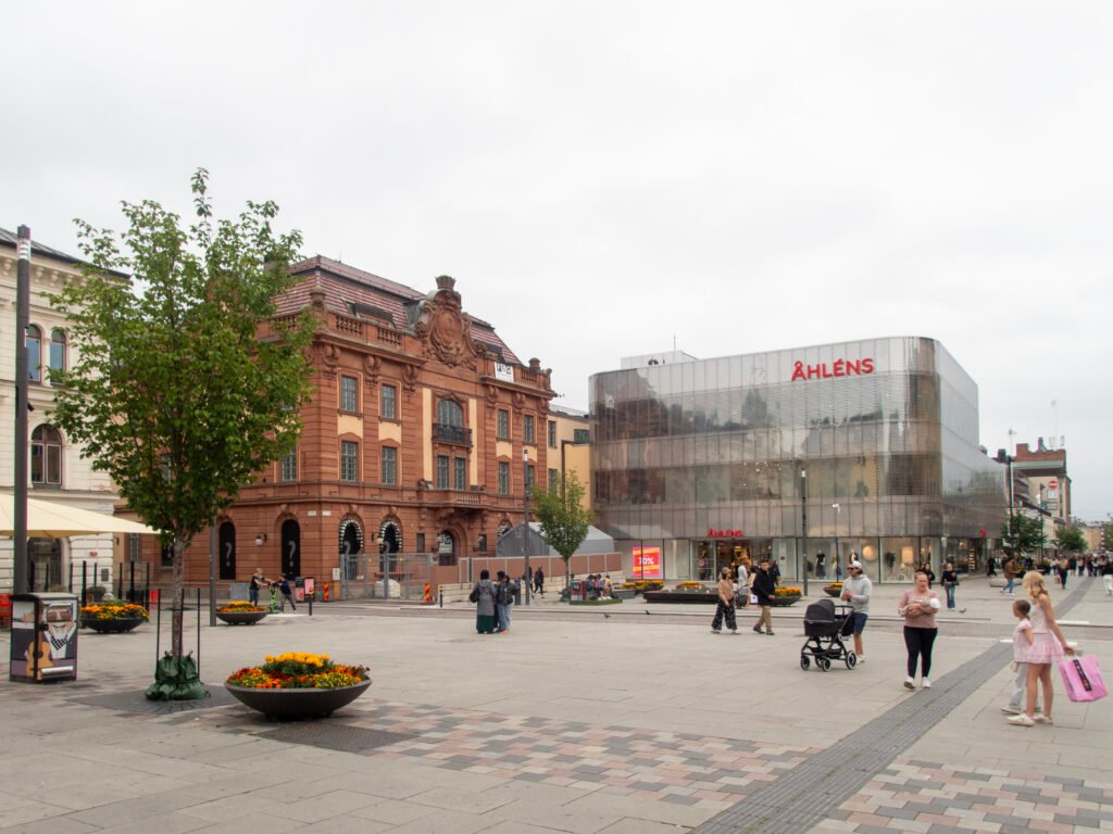 Pedestrians crossing Stora Torget in central Uppsala