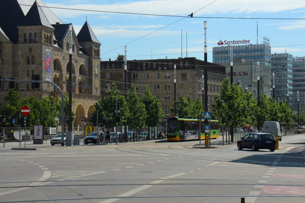 Święty Marcin street with pedestrians and trams at the Zamek stop in central Poznań