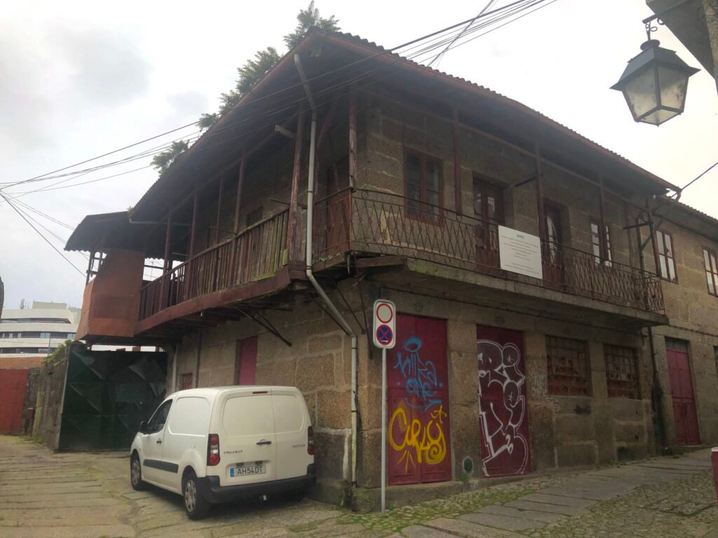 Rua de Vila Verde in Guimarães’s Zona de Couros with stone paving and historic industrial buildings